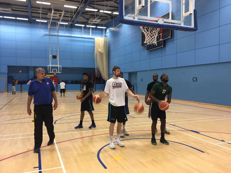 Players running a dribbling drill led by Diego Maggi