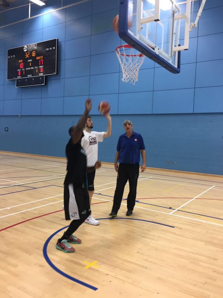 Player putting up a shot during a game with Diego coaching