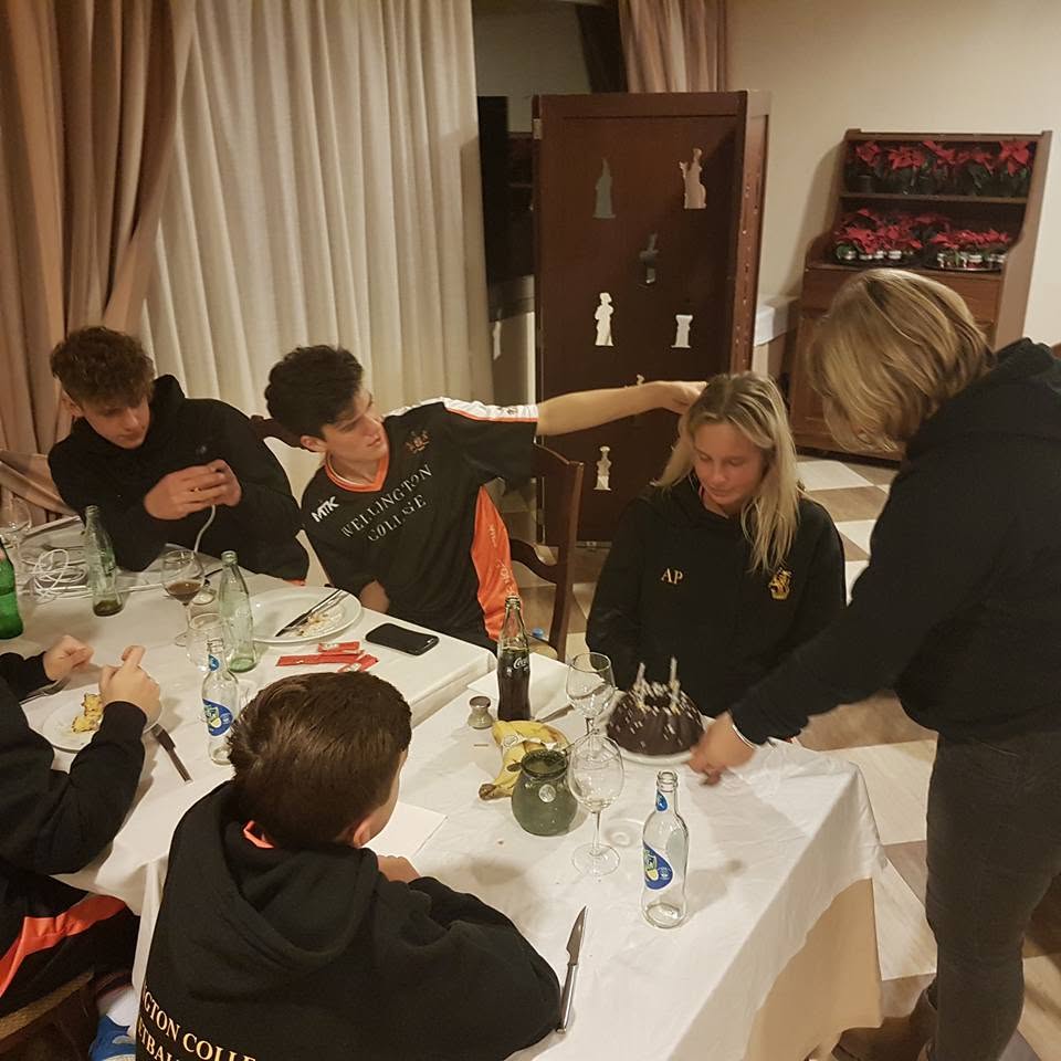 Team dinner celebration with cake